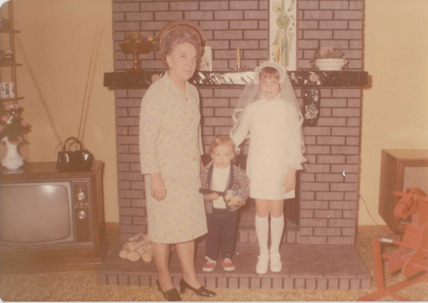 Anna with Bob & Jane First Communion.png
