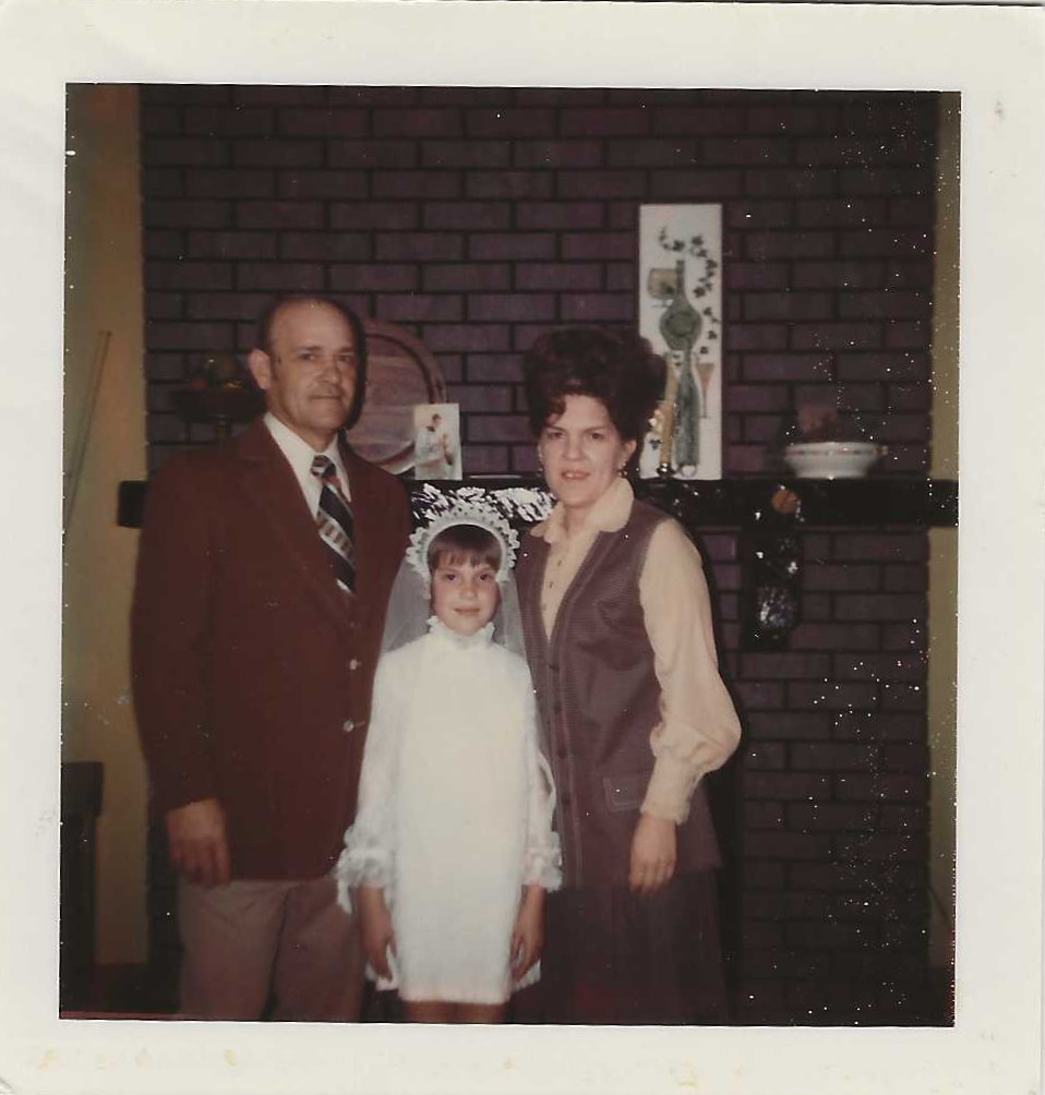 Frank & Rita with Jane First Communion.png