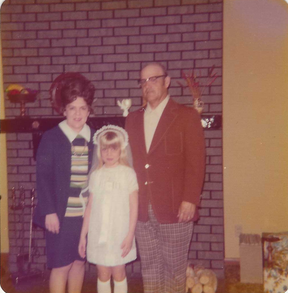 Rita and Frank with Beth First Communion.png