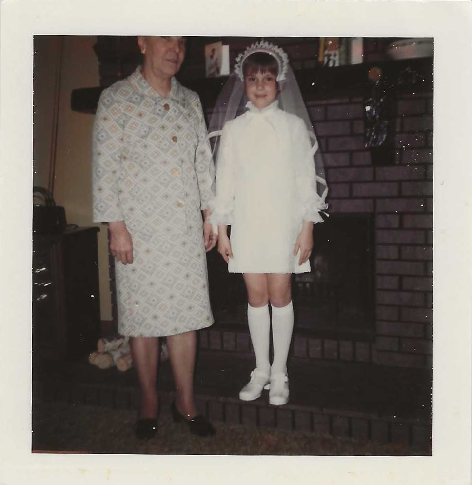 Anna with Janie First Communion.png
