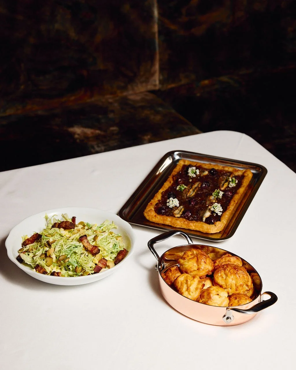  NY Times 
 The Paris Cafe returns to the Seaport district 
