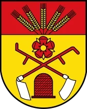 Das Wappen der Gemeinde Augustdorf mit Ähren, Pflug, der lippischen Rose und dem Bienenkorb