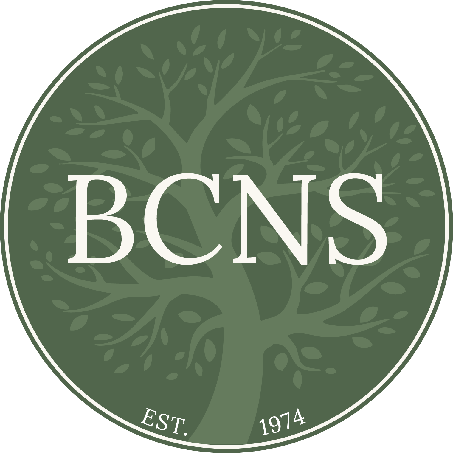 A circular green logo featuring a tree with multiple branches and leaves. White text in the center reads 'BCNS', with smaller white text at the bottom reads 'EST. 1974'.