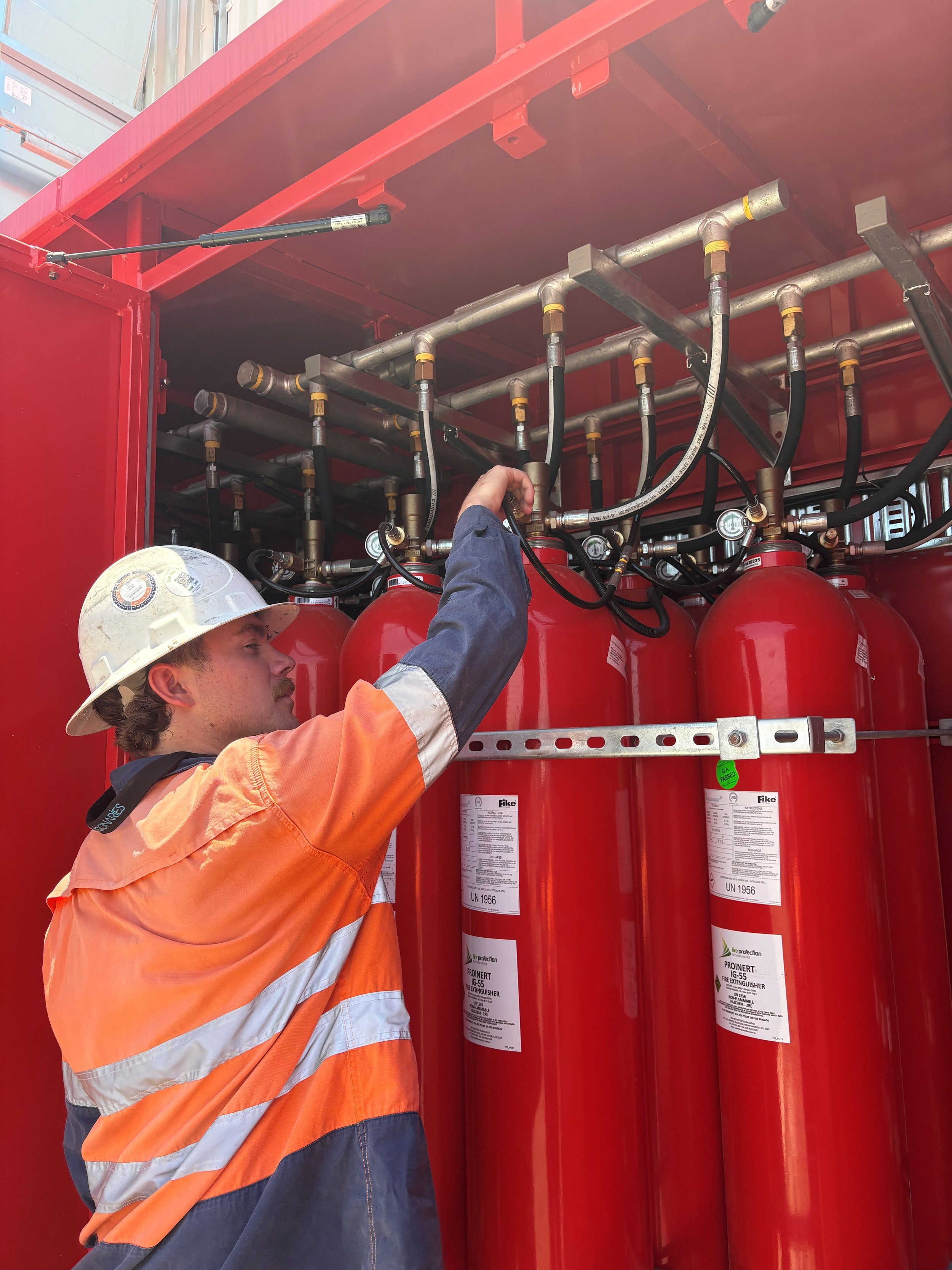 RPS fire employee working on fire extinguisher