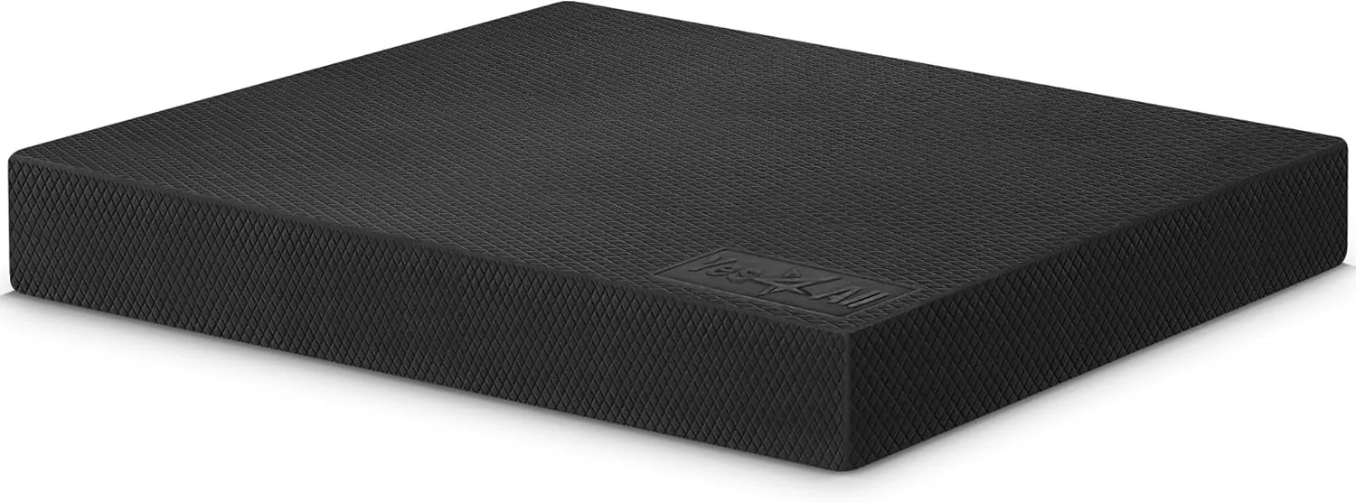 A black textured exercise or yoga mat with the brand name 'Nourish' embossed in the corner.