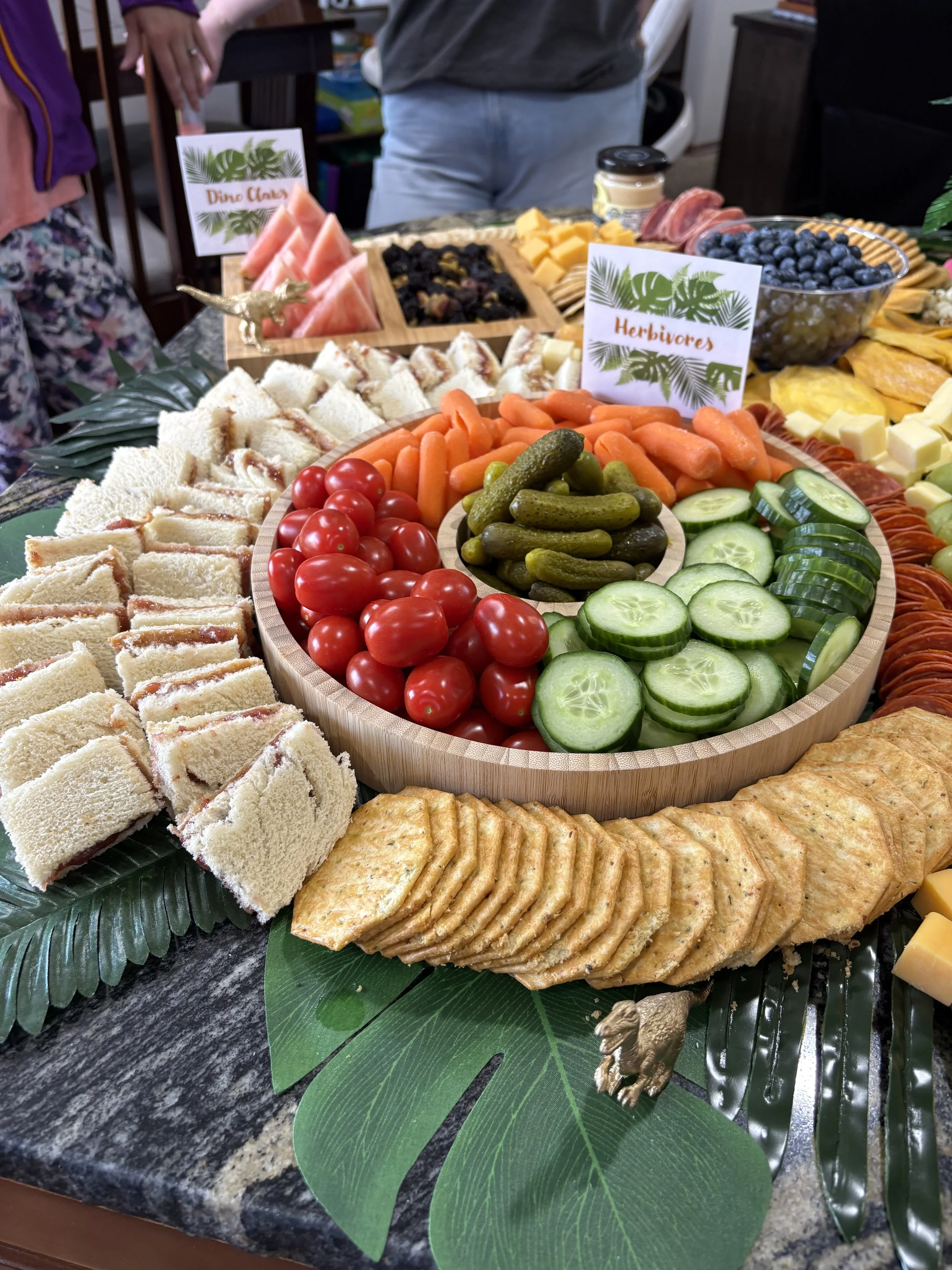 A beautifully set dining table with a floral centerpiece, wine glasses, plates, and napkins in an elegant setting.