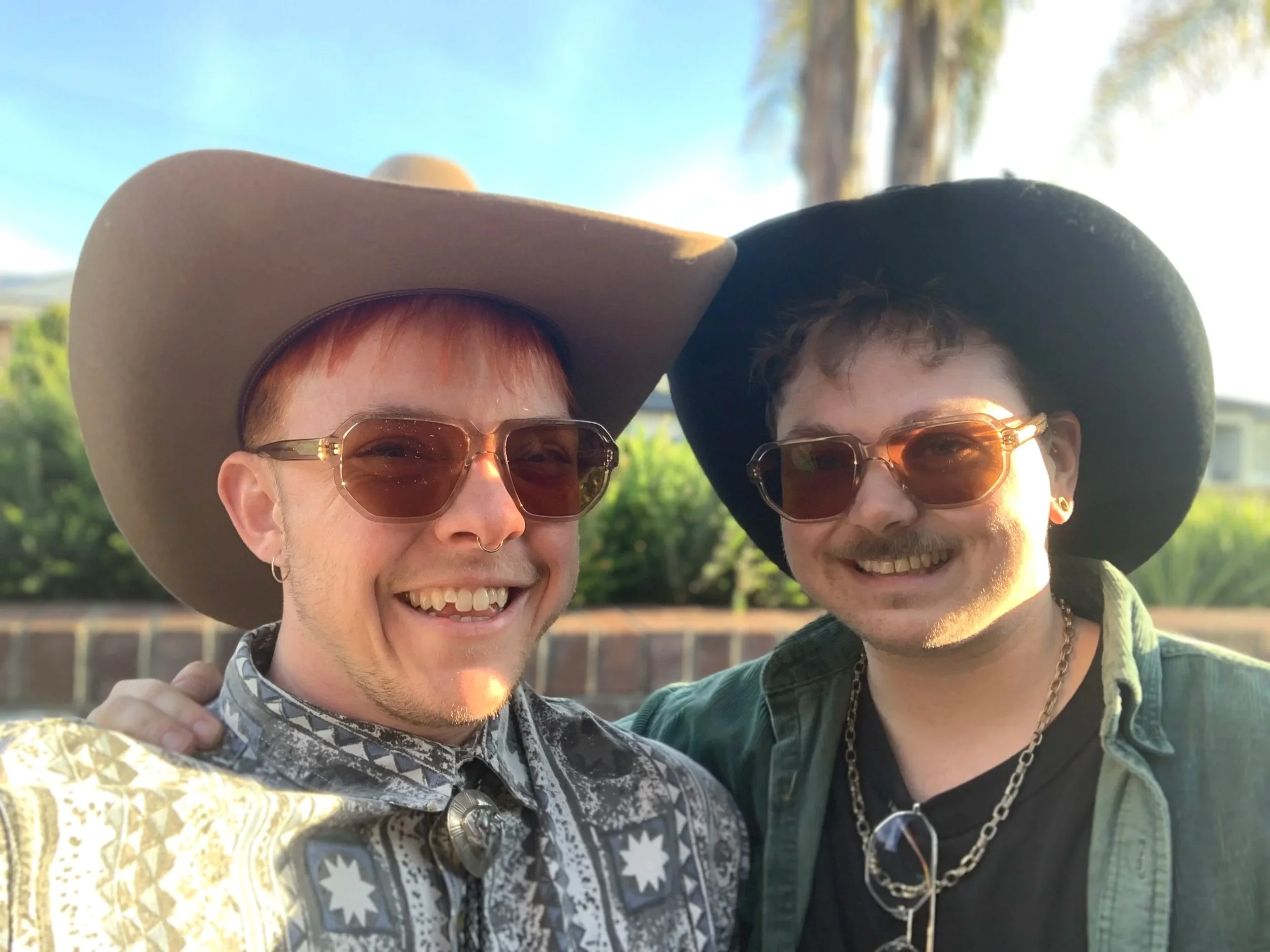 Denver & Seth in their cowboy hats and matching sun glasses