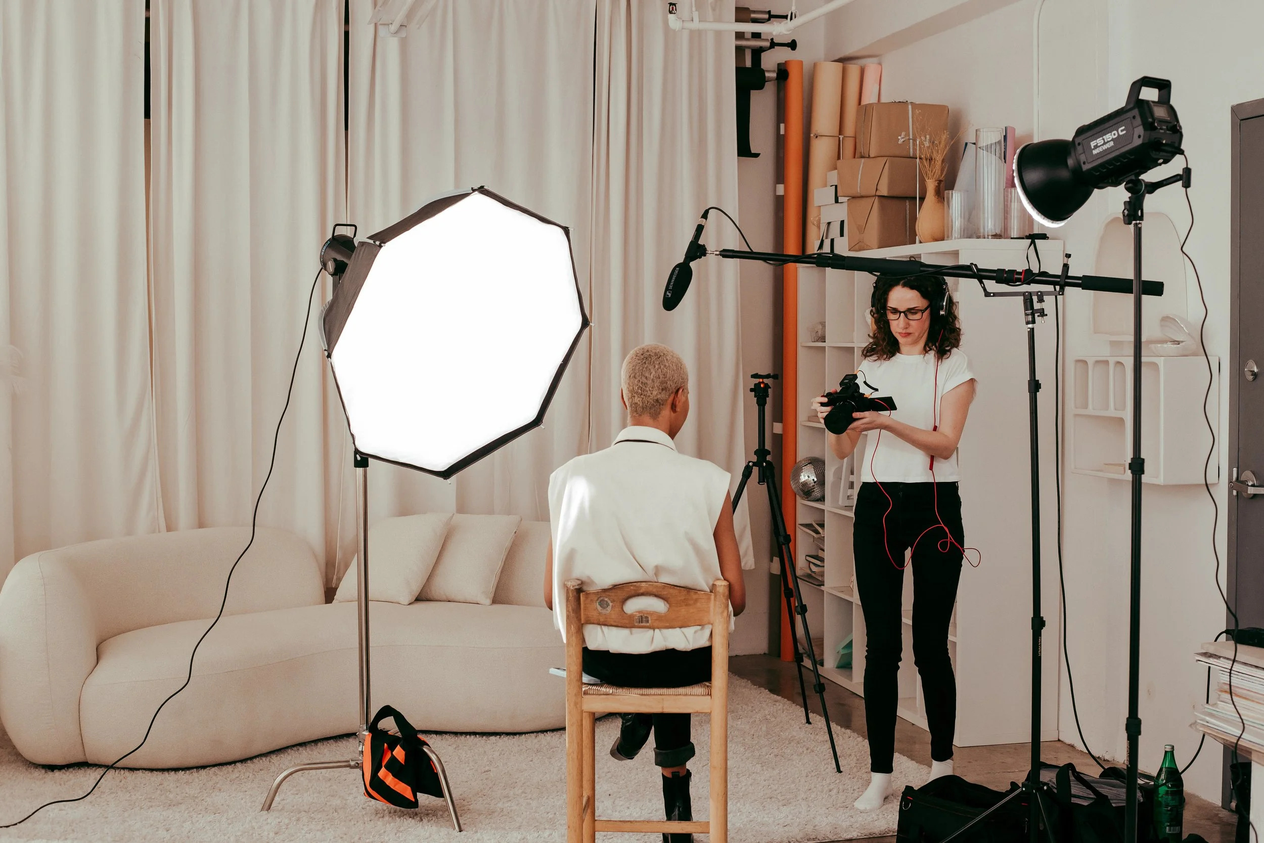 Female videographer setting up the shot