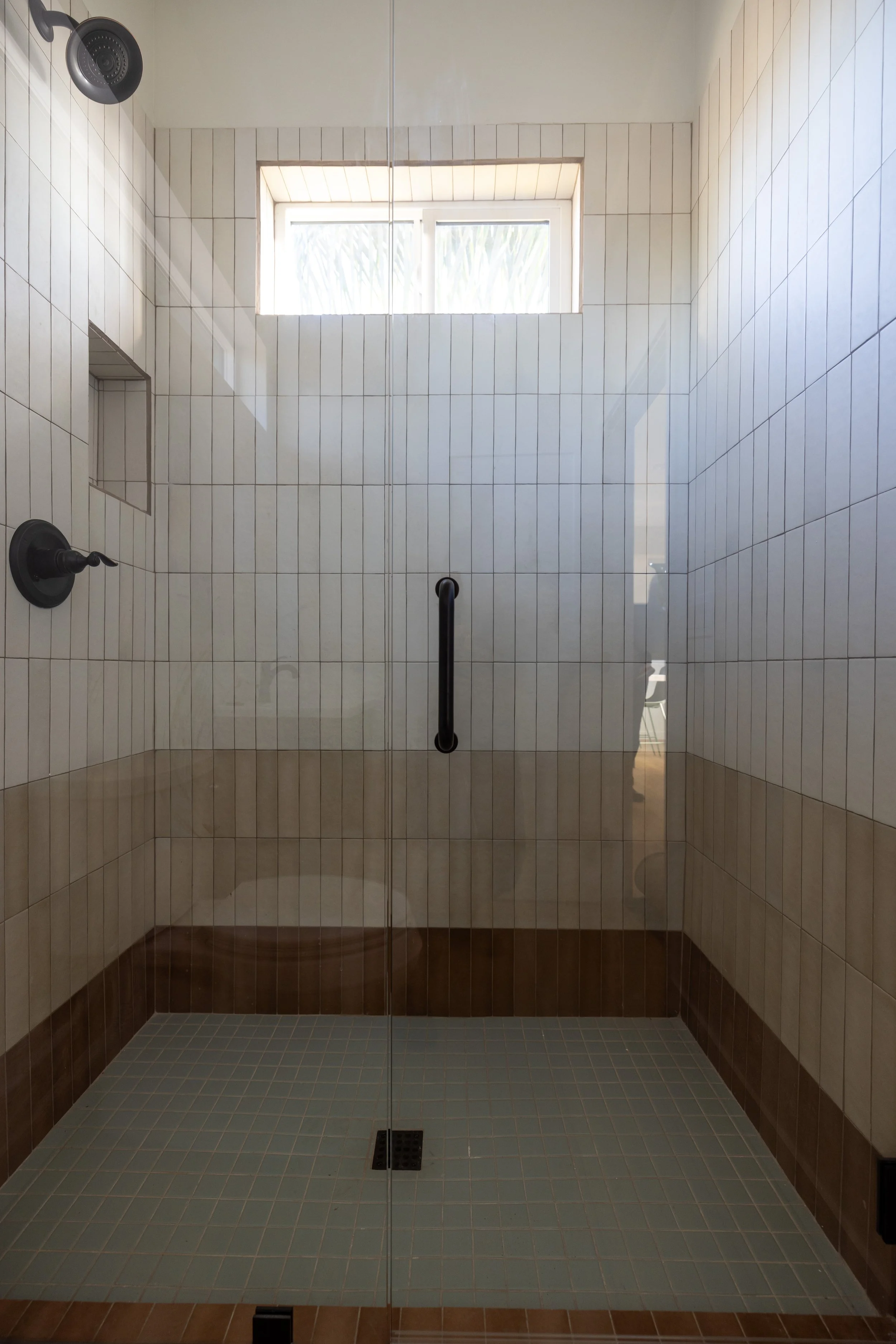 Bright and playful shower for this ADU in Carlsbad, California designed by Geis Architecture