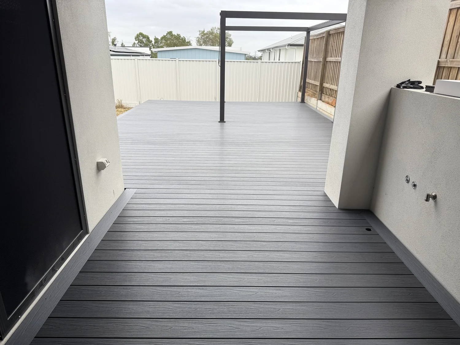 Grey composite decking Brisbane — modern courtyard