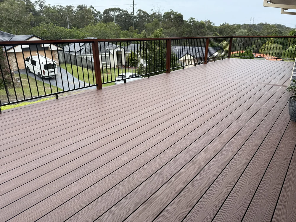 Composite deck builder Brisbane — wide deck with forest views