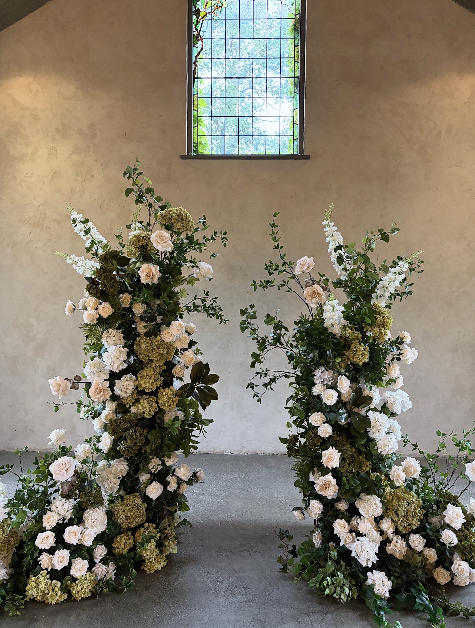Pair of Towers - Heavy Foliage & Floral Coverage in Asymmetric Design with additional florals