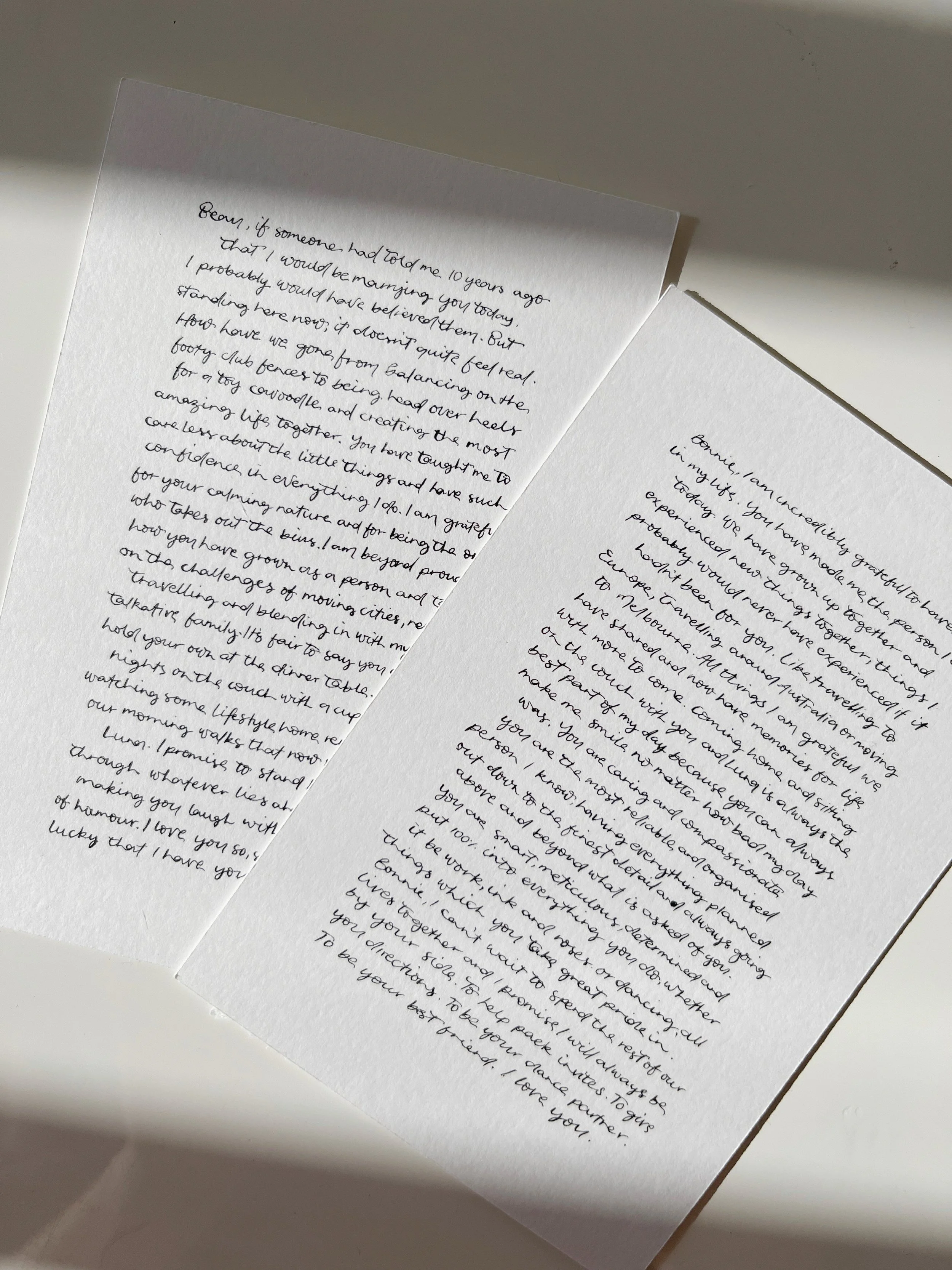 Handwritten wedding vows in modern calligraphy on white 300gsm cardstock, styled as a matching vow set keepsake