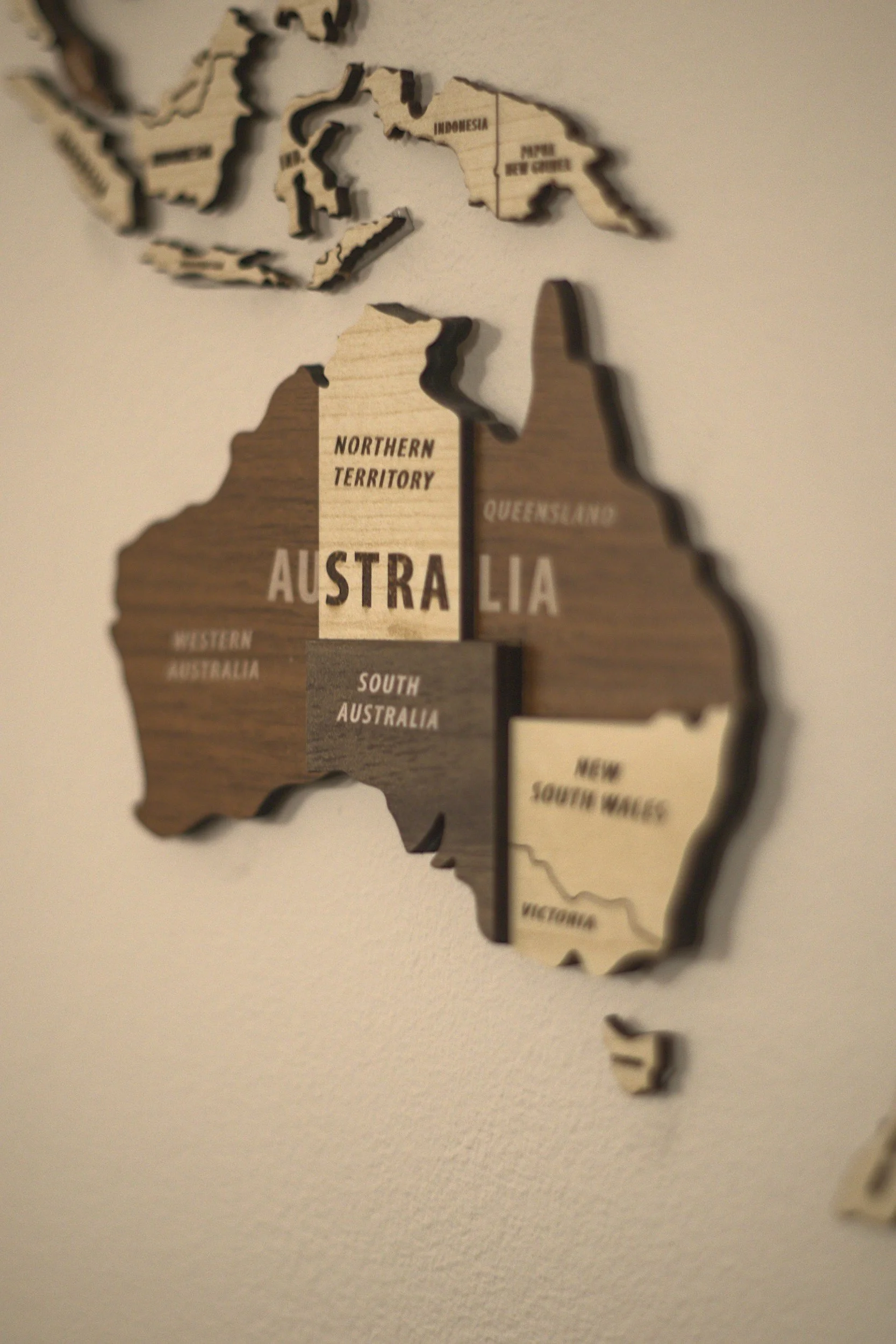 Wooden wall map of Australia with labeled regions including Western Australia, Northern Territory, South Australia, Queensland, New South Wales, and Victoria.