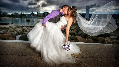 Wedding couple photographed by the sea