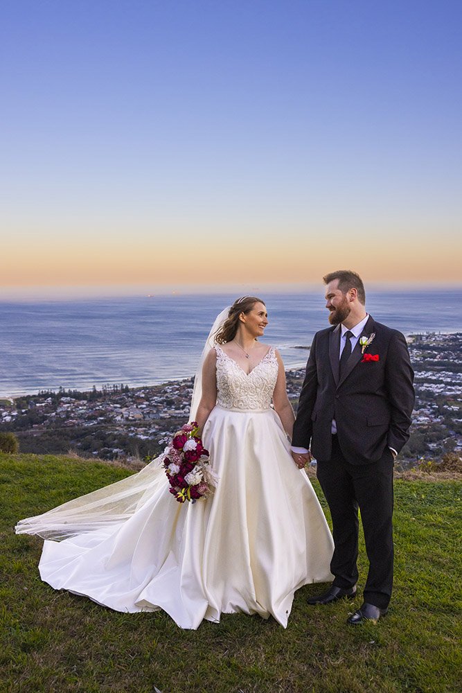 Bride and groom photographed at sunset