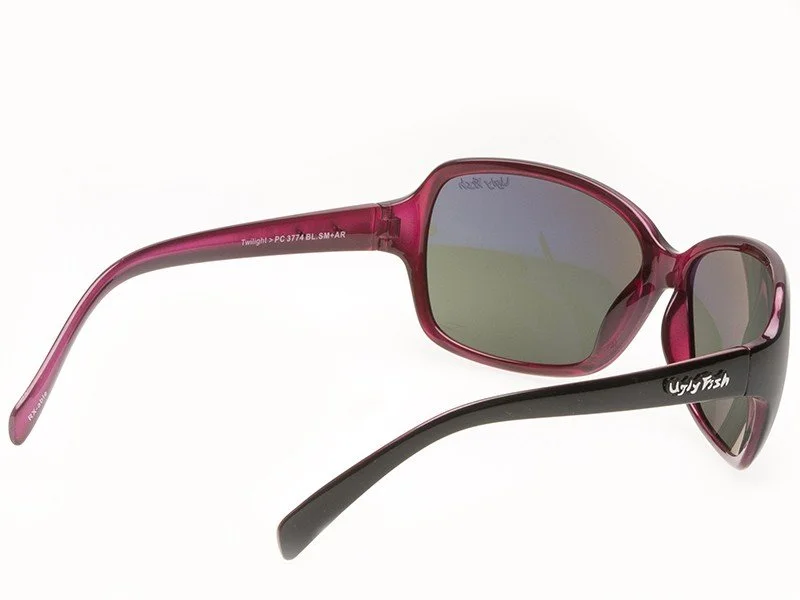 Pink and black sunglasses with gray lenses on a white background.