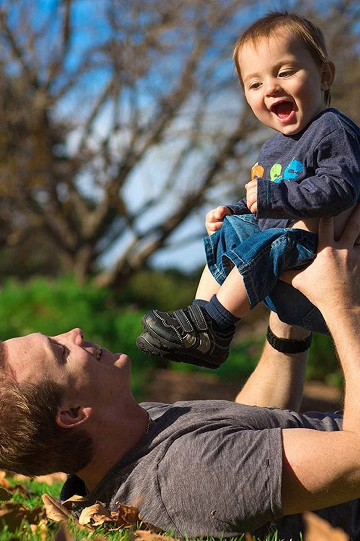 Parent and child enjoying an outdoor family session