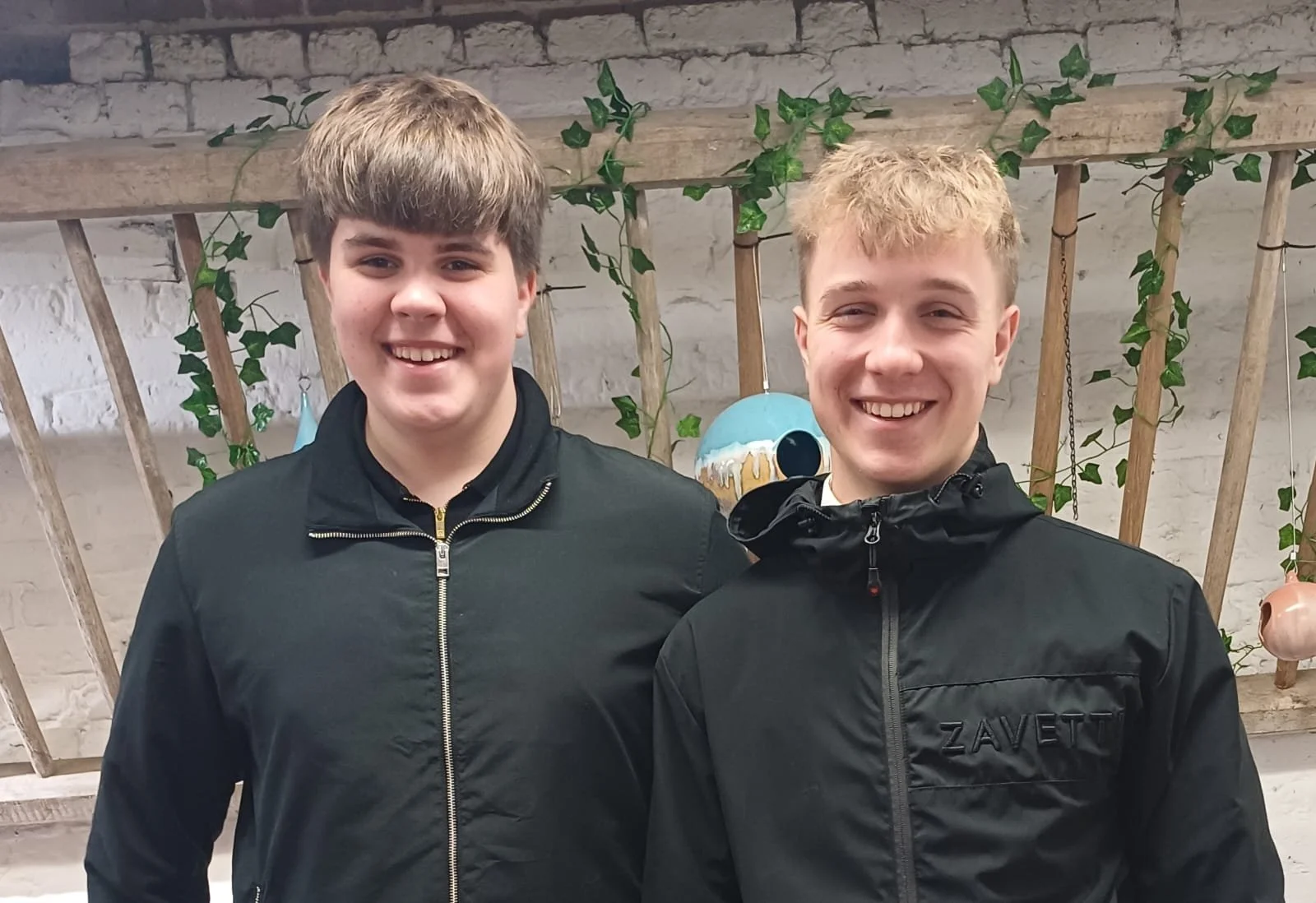 George and Zac sheppard selling their stoneware ceramic bird feeders as the bird boys at a craft event.