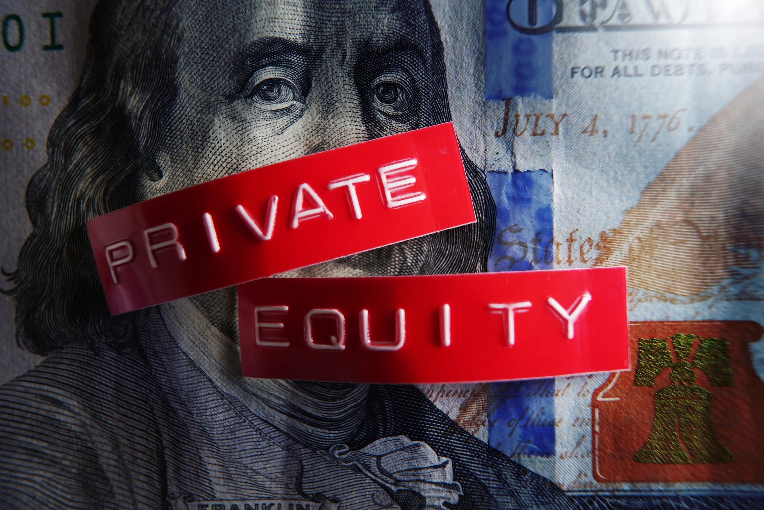 A close-up photograph of a U.S. hundred-dollar bill with two red labels, one reading 'PRIVAT E' and the other 'EQUITY', covering Benjamin Franklin's portrait.
