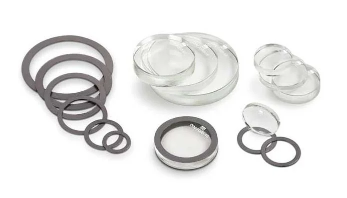 Cristales circulares de transparencia para mirillas. Permiten control visual seguro del nivel de líquidos en recipientes a presión y procesos industriales exigentes.