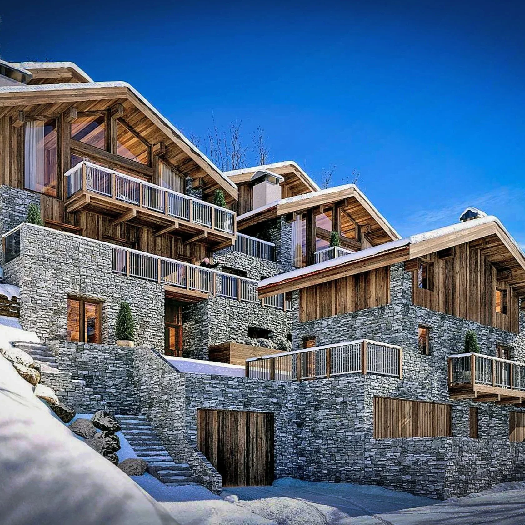 Façade en pierre et bois d’un chalet de prestige de 337 m² à vendre à Saint-Martin-de-Belleville, au cœur des 3 Vallées