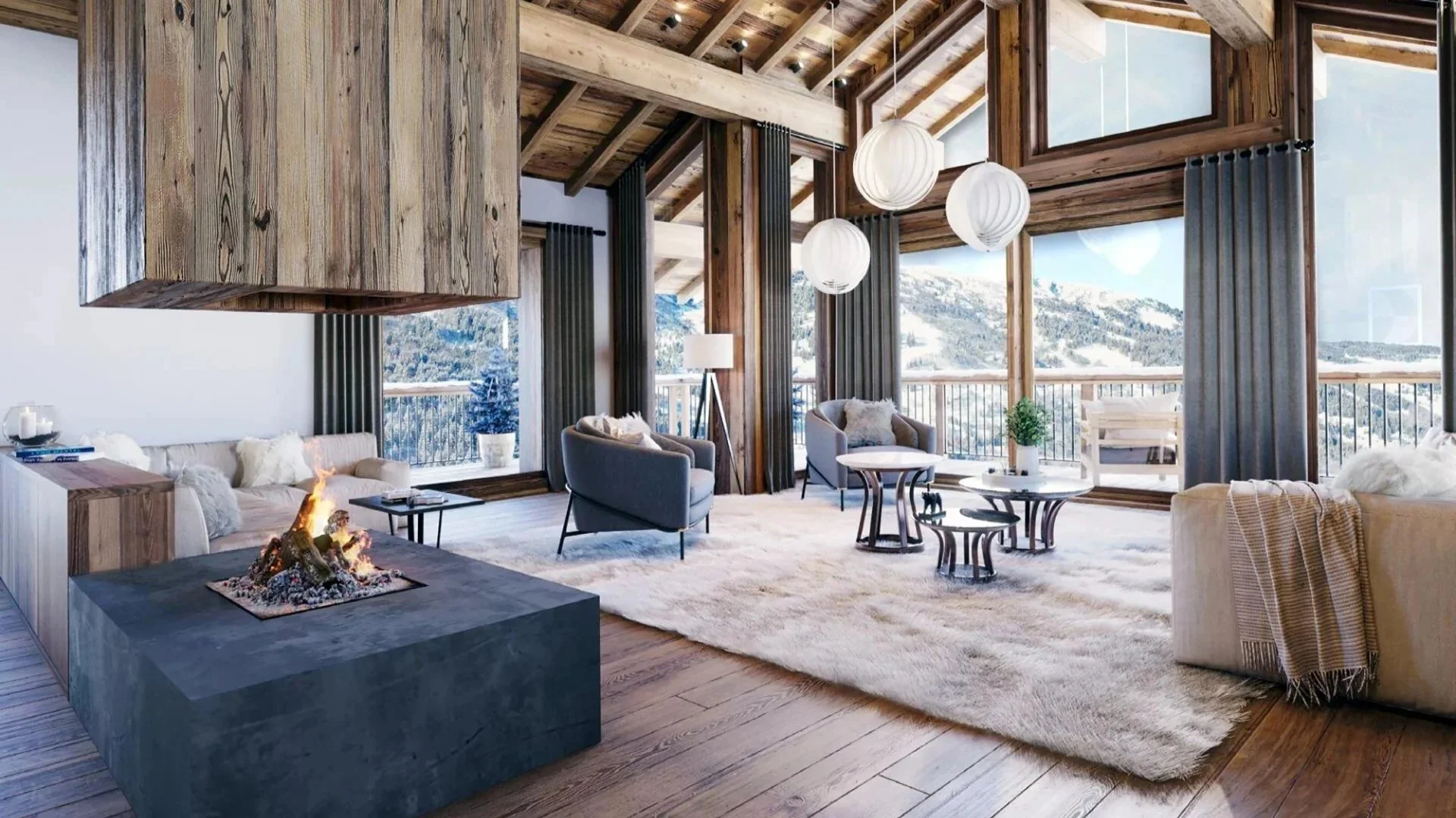 Salon lumineux d’un chalet de prestige près de Saint-Martin-de-Belleville, avec charpente apparente, cheminée contemporaine, grandes baies vitrées et vue panoramique sur les montagnes des 3 Vallées.