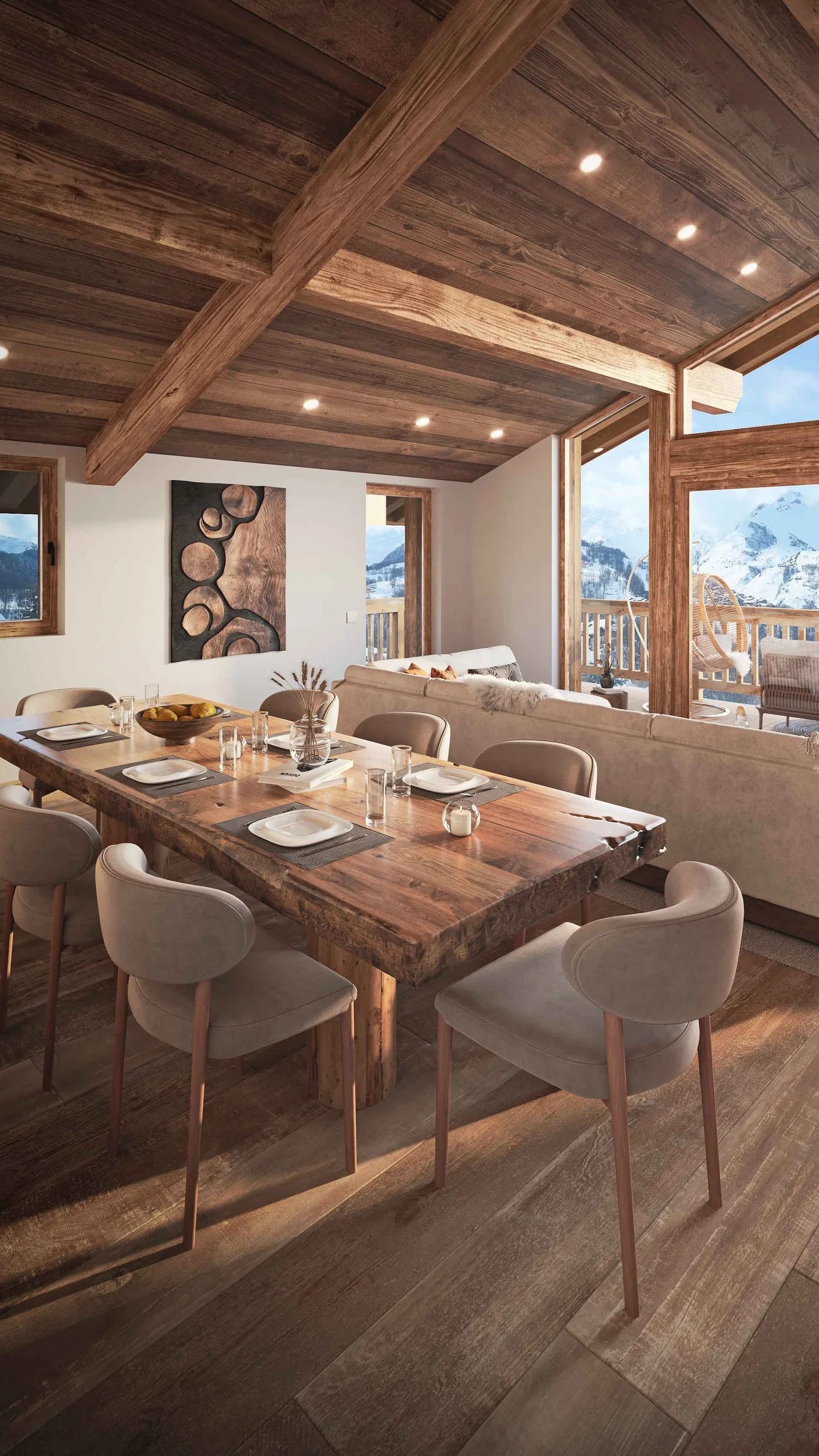 Salon de prestige avec charpente apparente et vue exceptionnelle sur les Alpes depuis un appartement à vendre à Saint-Martin-de-Belleville.