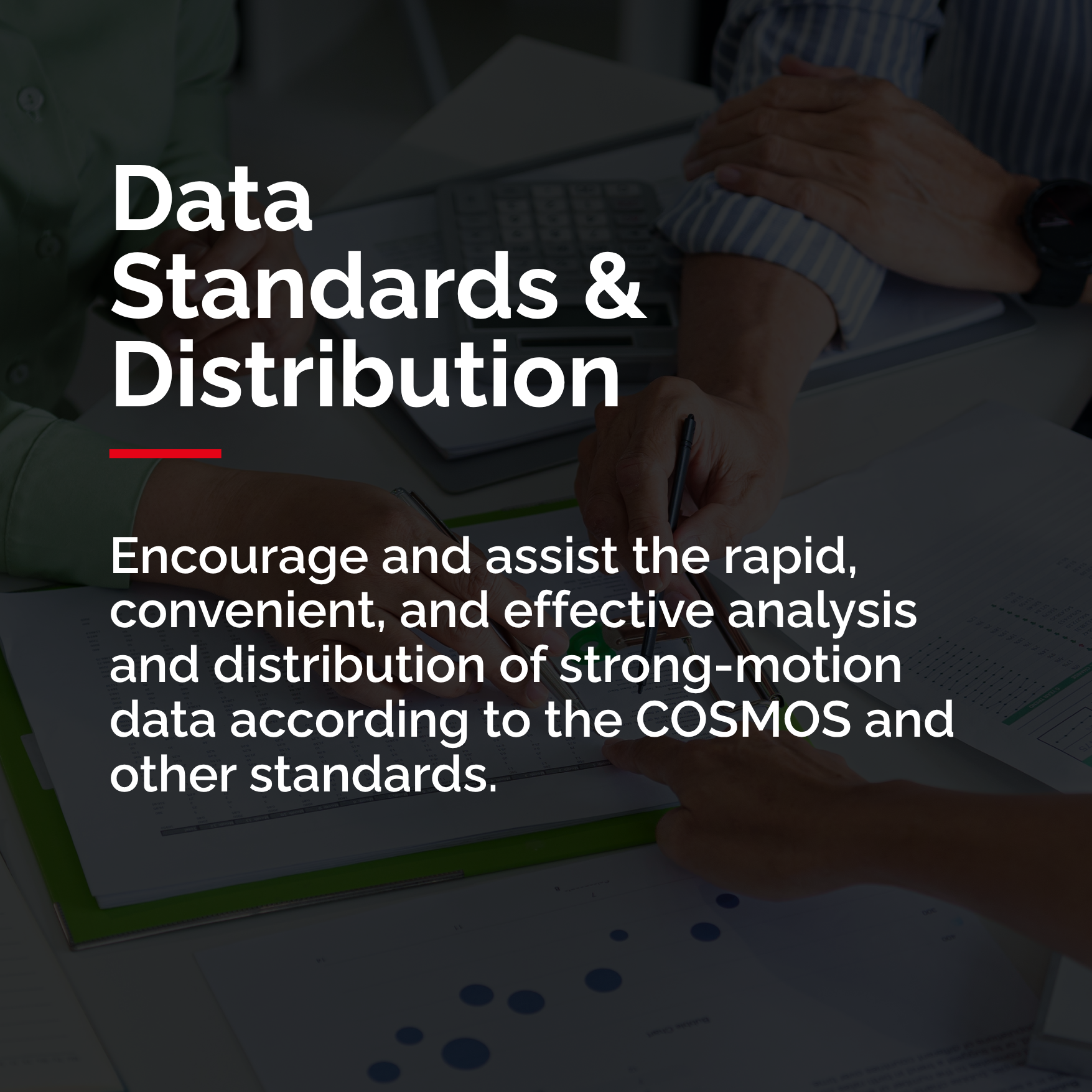 People pointing to graphs and papers on a table showing the analysis of strong-motion data