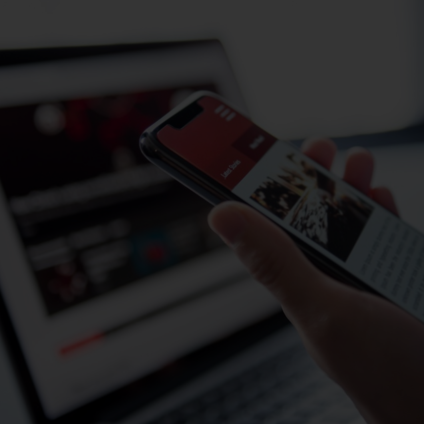 Phone being held up viewing a publication to be read about strong motion data.