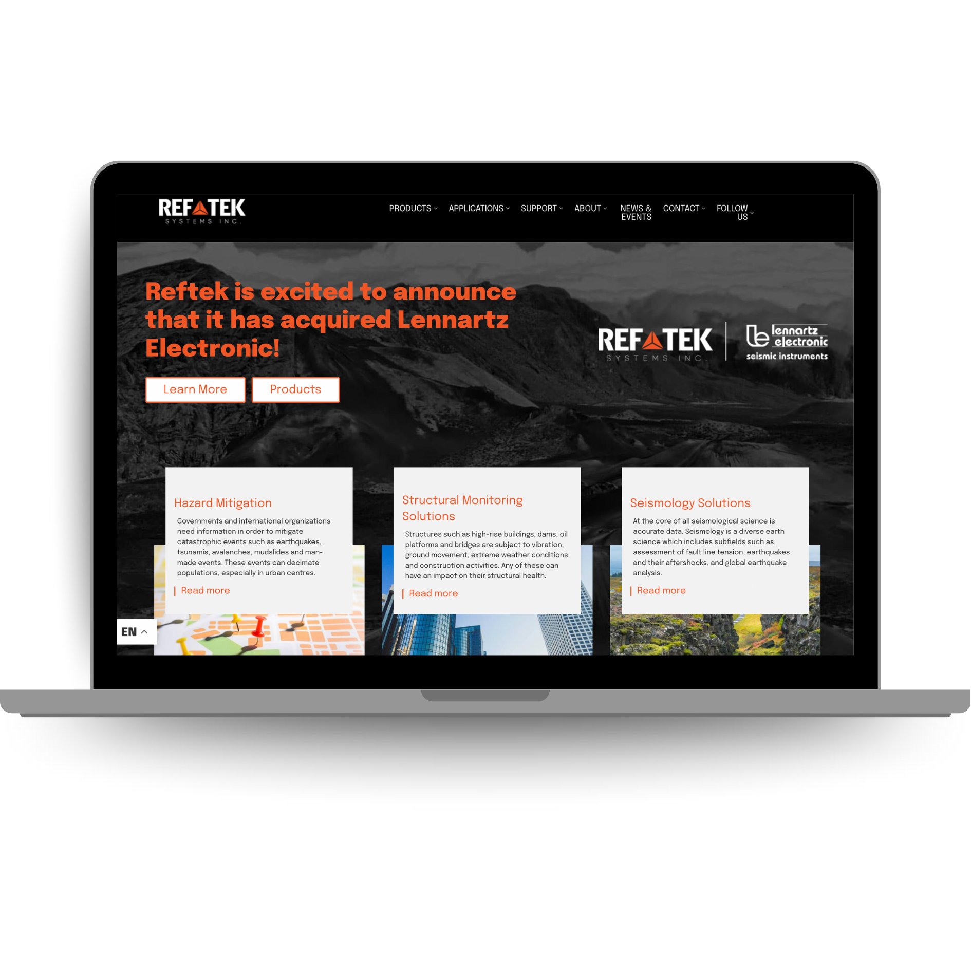 Laptop displaying the RefTek Systems website highlighting seismic data recorders and monitoring technologies for hazard mitigation and structural analysis.