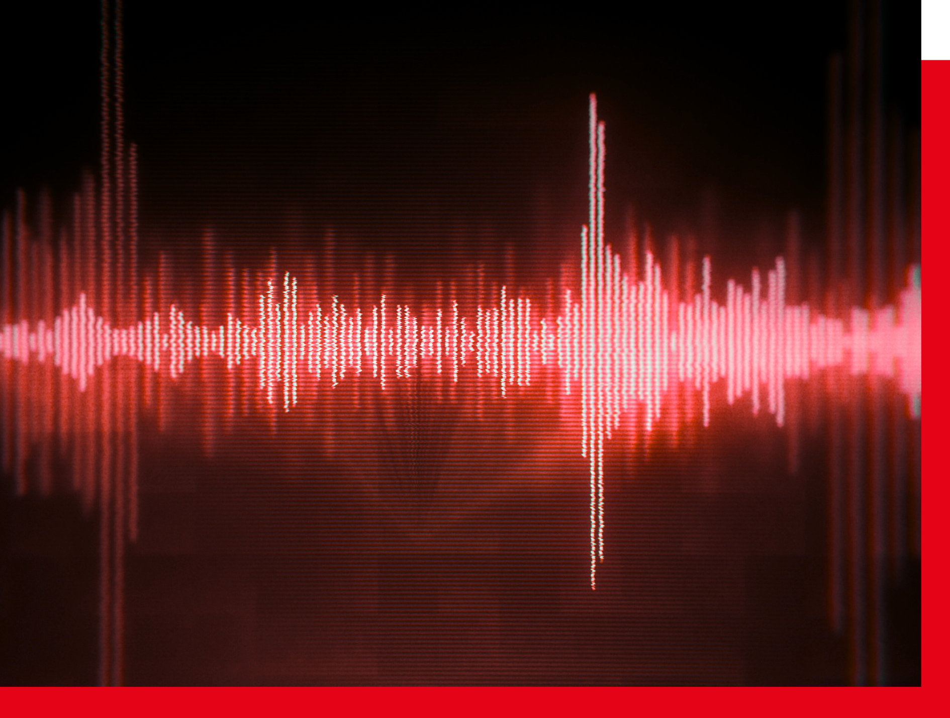 Red digital waveform displaying seismic activity data, symbolizing earthquake motion and strong-motion recording technology.