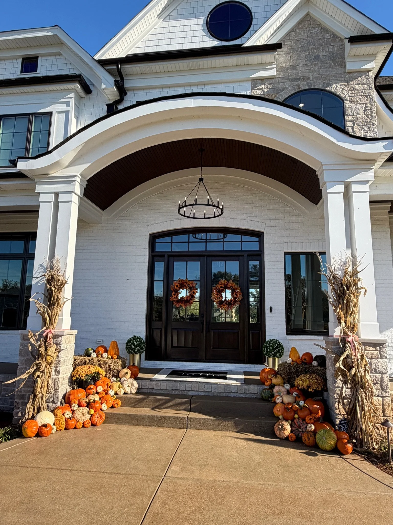 Elegant pumpkin porch design in Crestwood, KY featuring specialty pumpkins and seasonal accents.