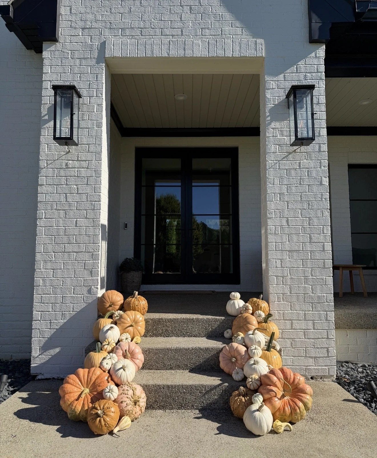 Residential pumpkin porch installation in Crestwood by Holiday Charm Fall Porch Decorating Muted Pumpkins. 