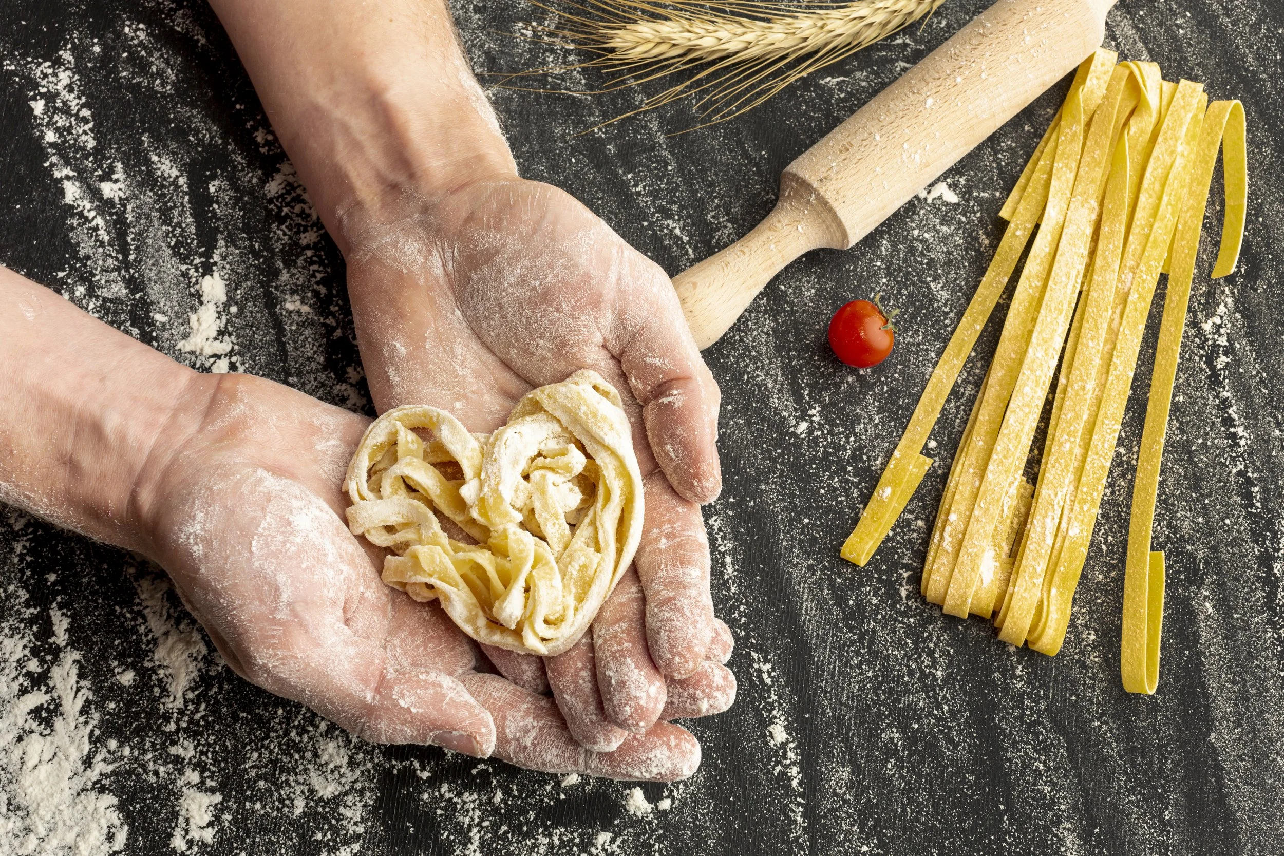 chef-holding-uncooked-pasta-hands.jpg