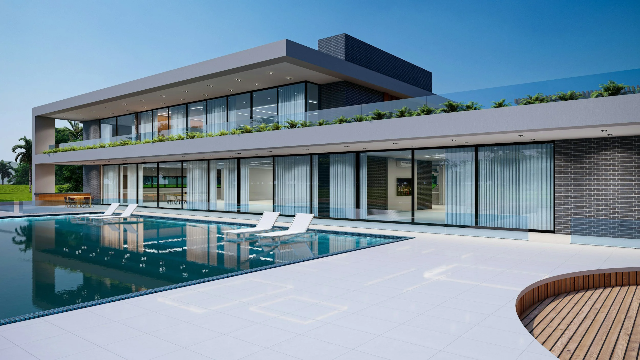 Modern two-story house with large glass walls and a swimming pool in the foreground, surrounded by white tile and sitting areas.