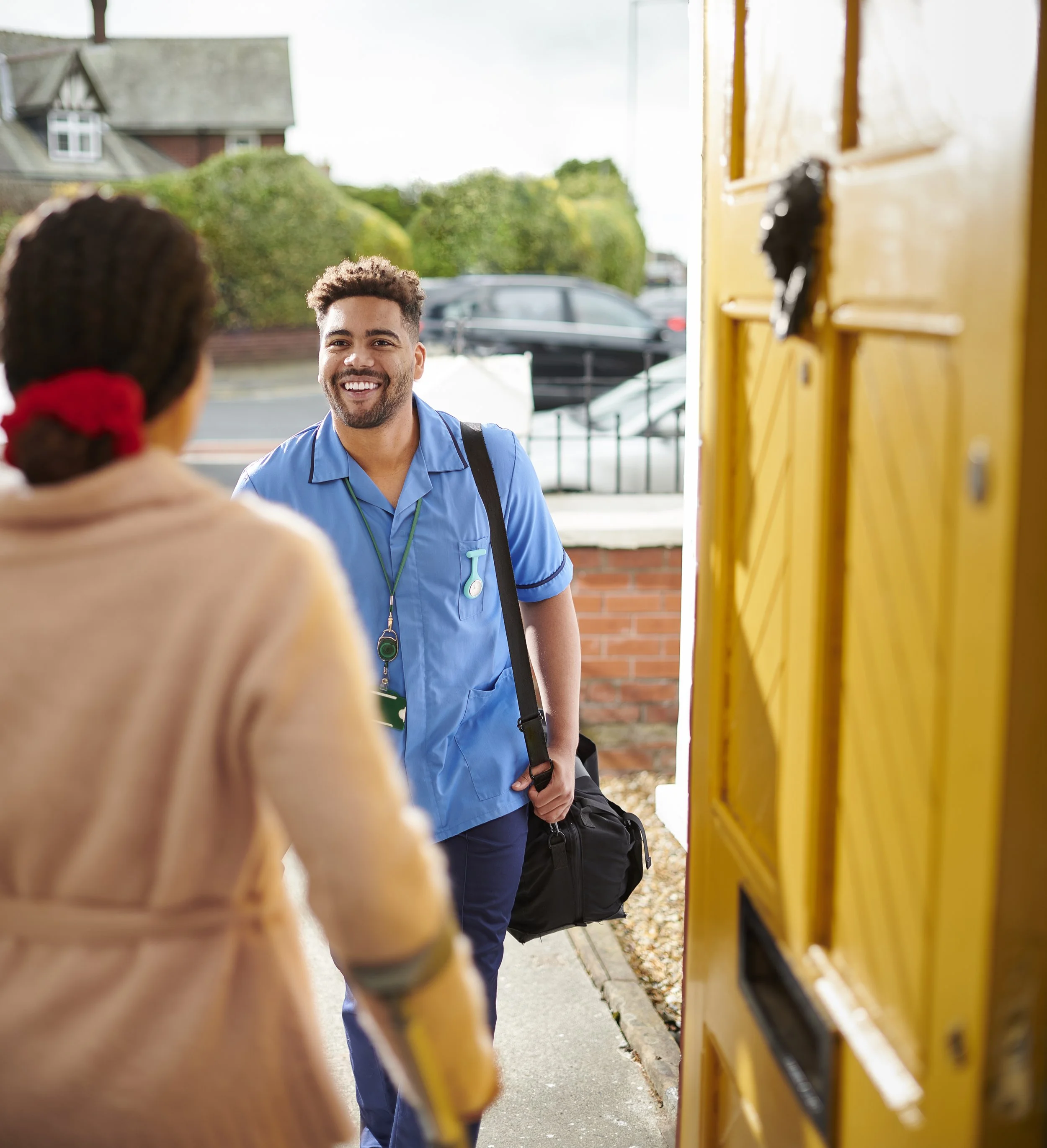 Orange lifebuoy hanging on a white wall, with a 'No diving' sign nearby.