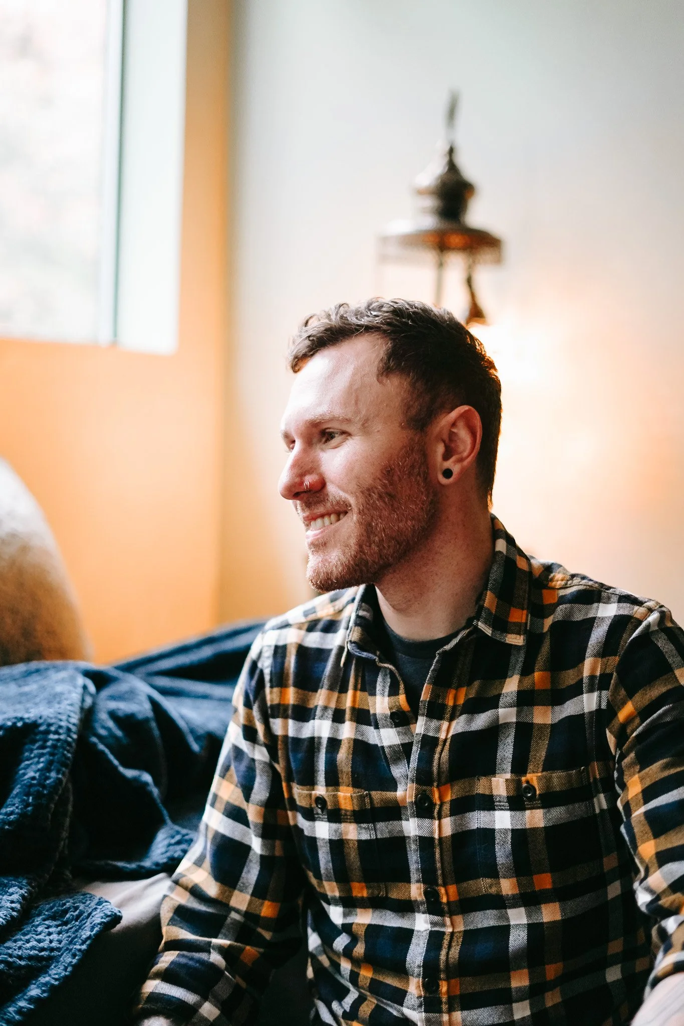 A smiling male therapist who provides therapy for patients in ketamine treatment.