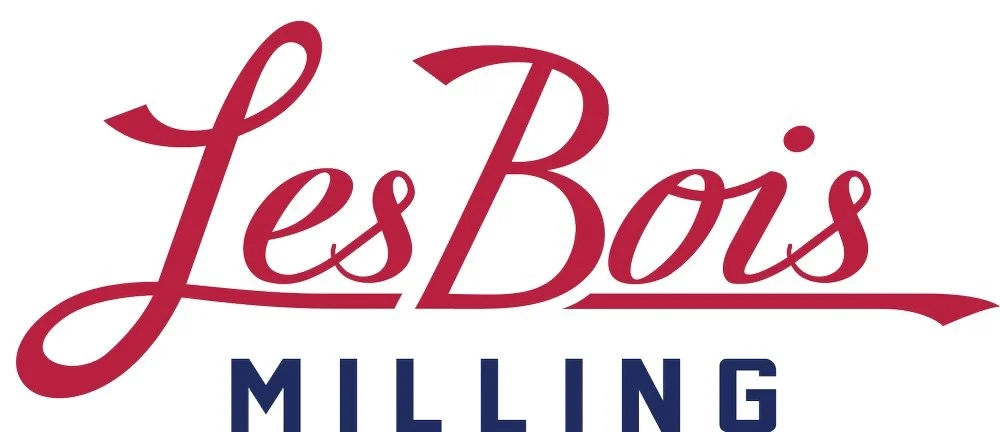 Logo for Les Bois Milling in cursive script with red and blue colors.