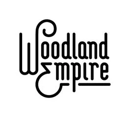 Woodland Empire logo in black text with stylized lettering