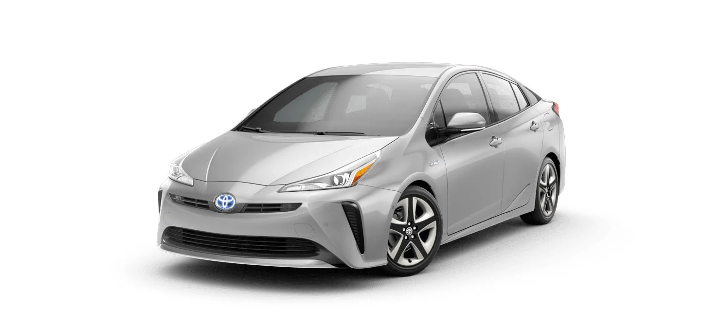 Silver Toyota Prius hybrid sedan on a white background.
