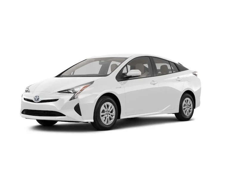 A white Toyota sedan car positioned at a three-quarter angle facing left against a plain white background.