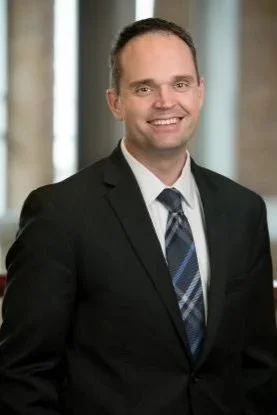 Professional headshot of Sam Huenergardt