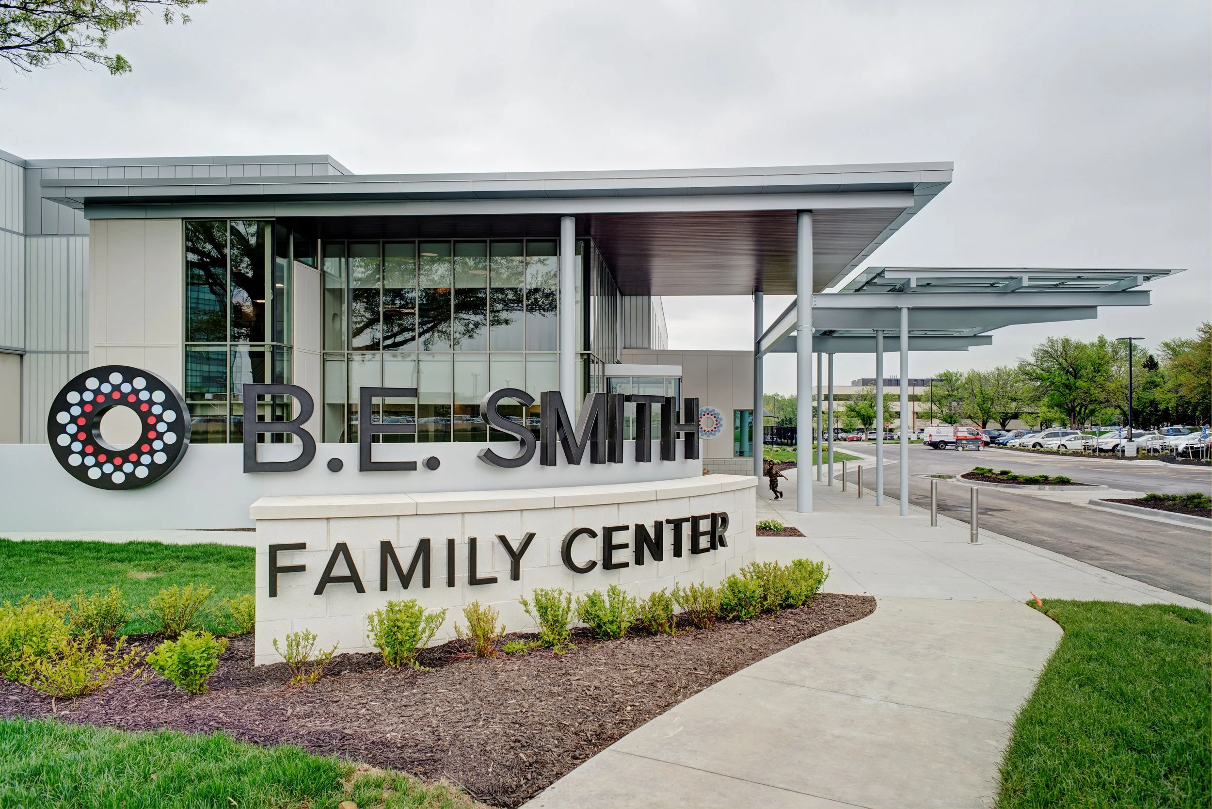 The exterior of the B.E. Smith Family Center, showing the building entrance and surrounding grounds.