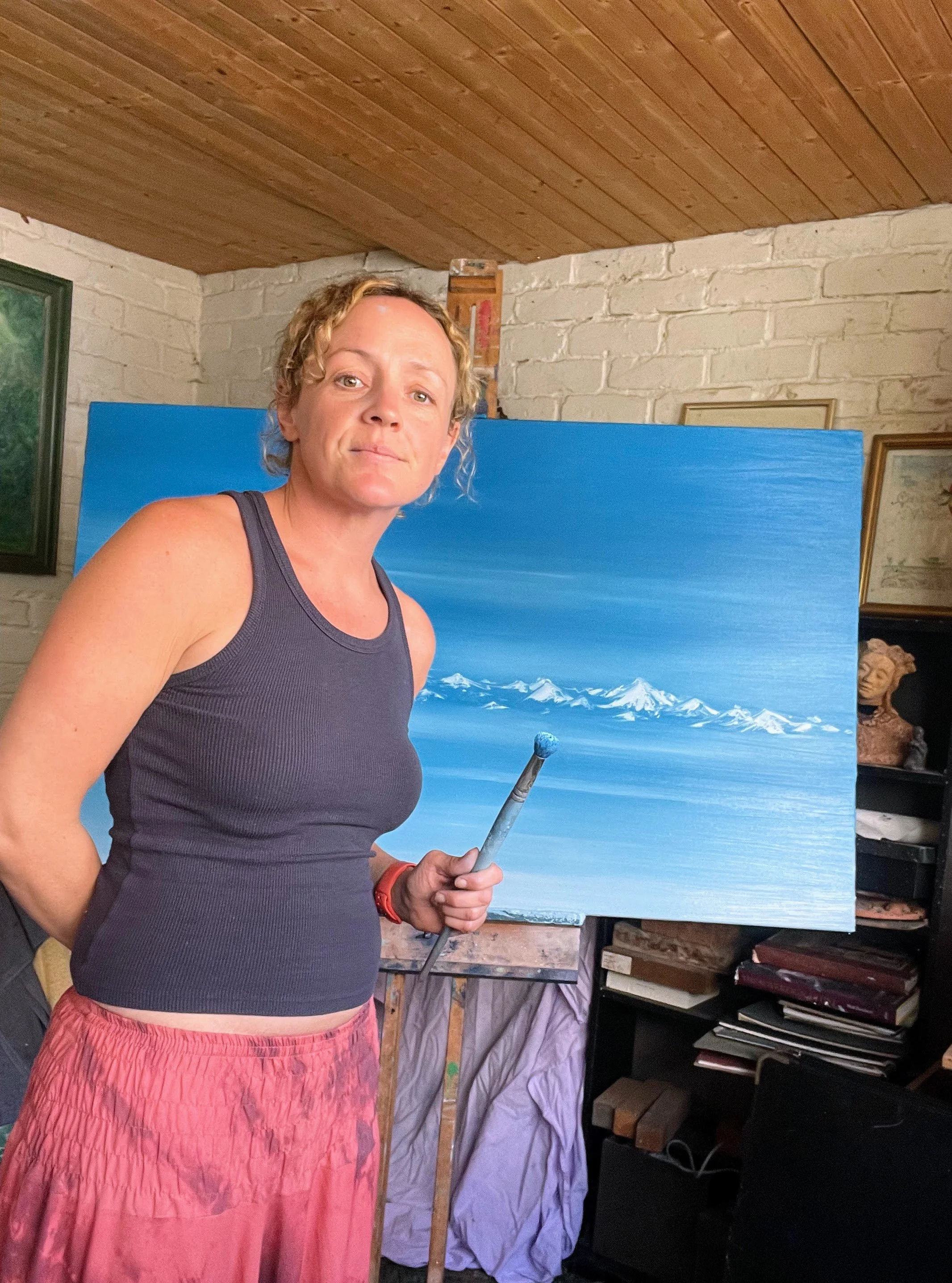 Cat Goward painting in her studio
