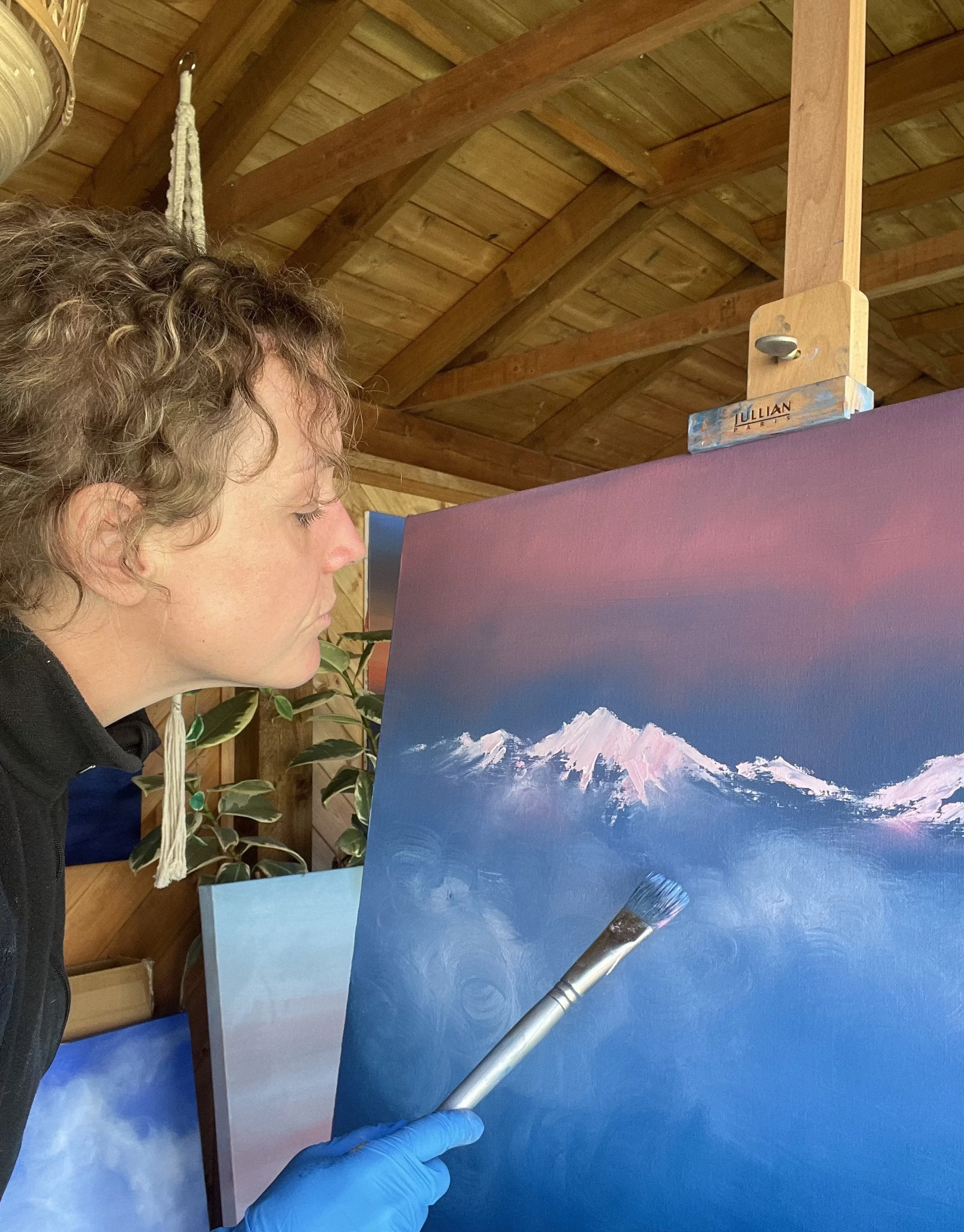 contemporary mountain artist cat goward painting in her London studio