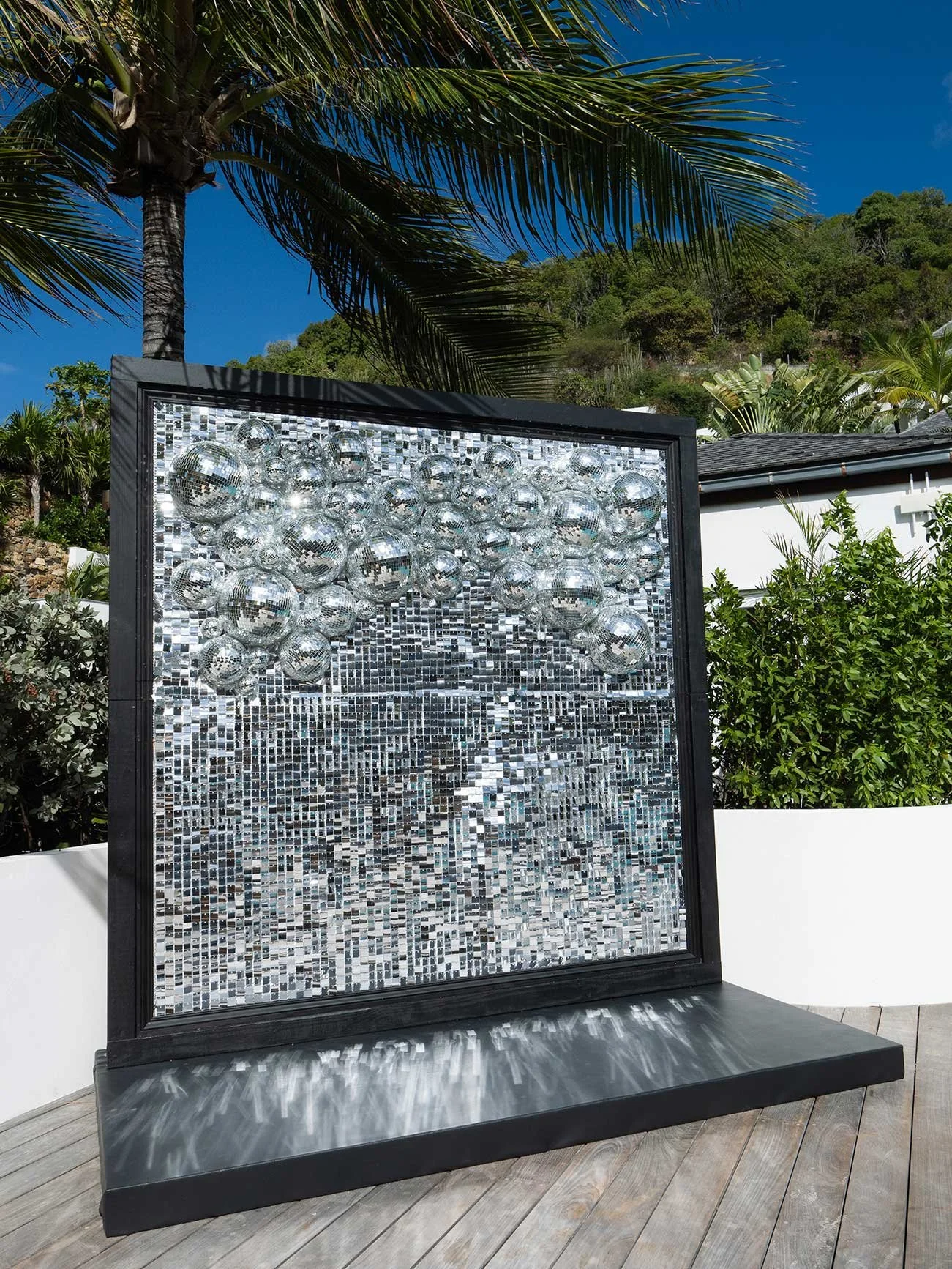 Silver reflective wall backdrop used as event decor for a luxury celebration in St Barth.