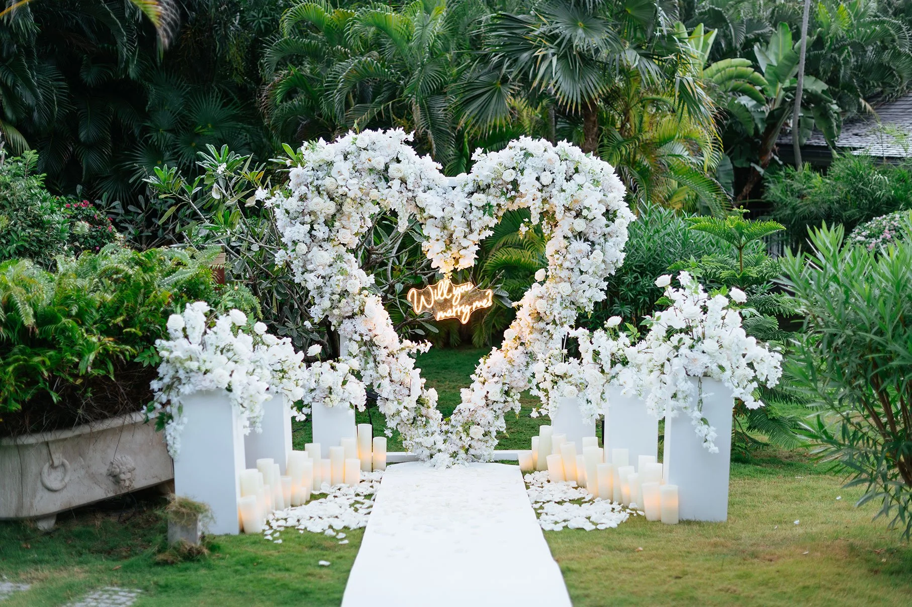 Romantic heart-shaped wedding floral arch made of white blooms, perfect for an elegant ceremony in St Barth.