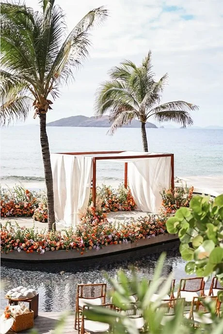 Peaceful beach scene with palm trees and turquoise ocean, perfect for a tropical St Barth wedding setting.