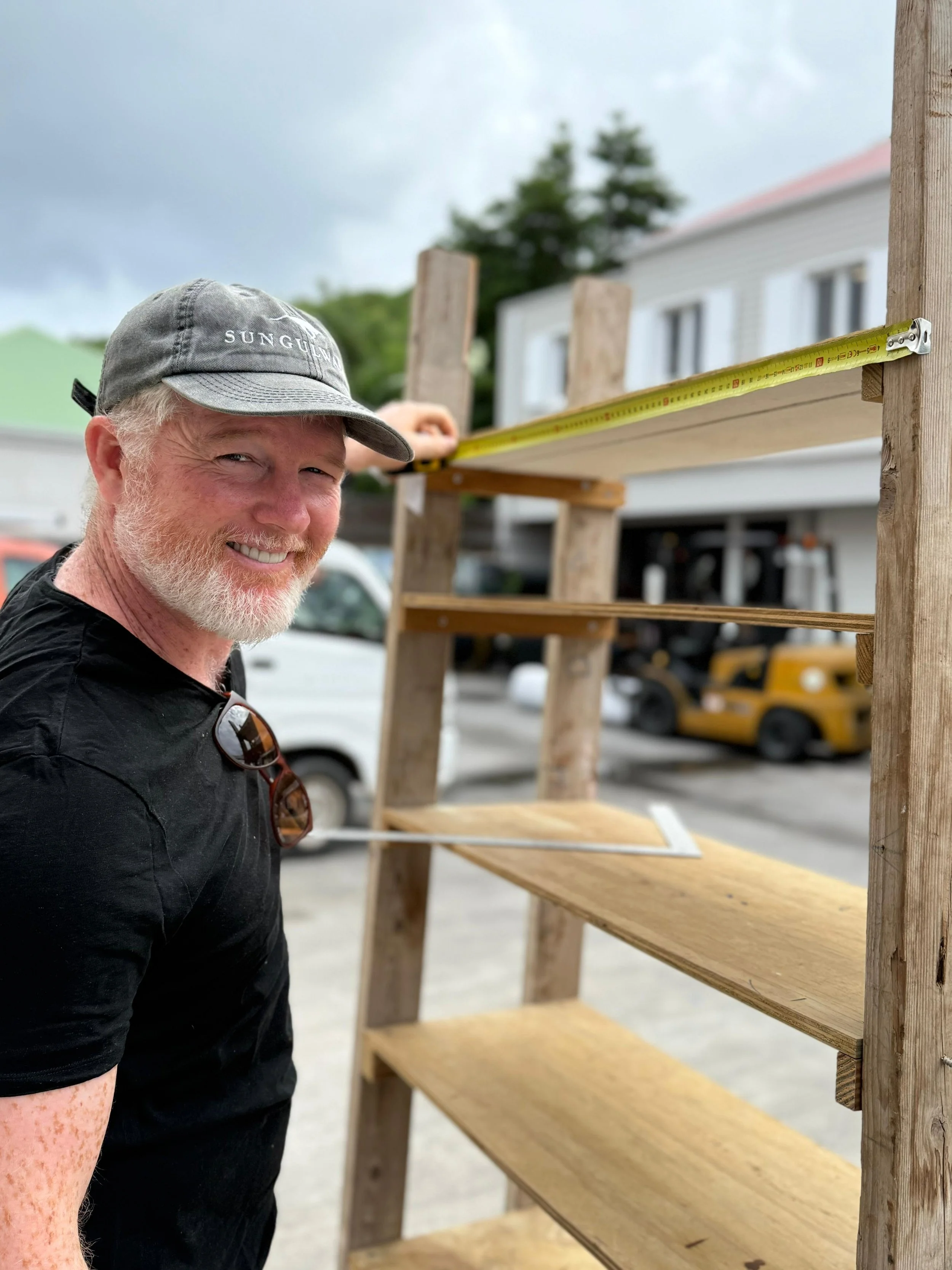 Christopher, production manager, preparing custom wooden structures for event decoration in St Barth.